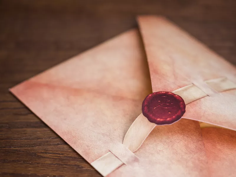 《搜寻魔戒》游戏包装，复古信封配红蜡封印